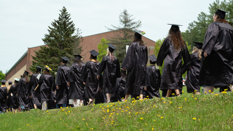 Graduates walking to commencement