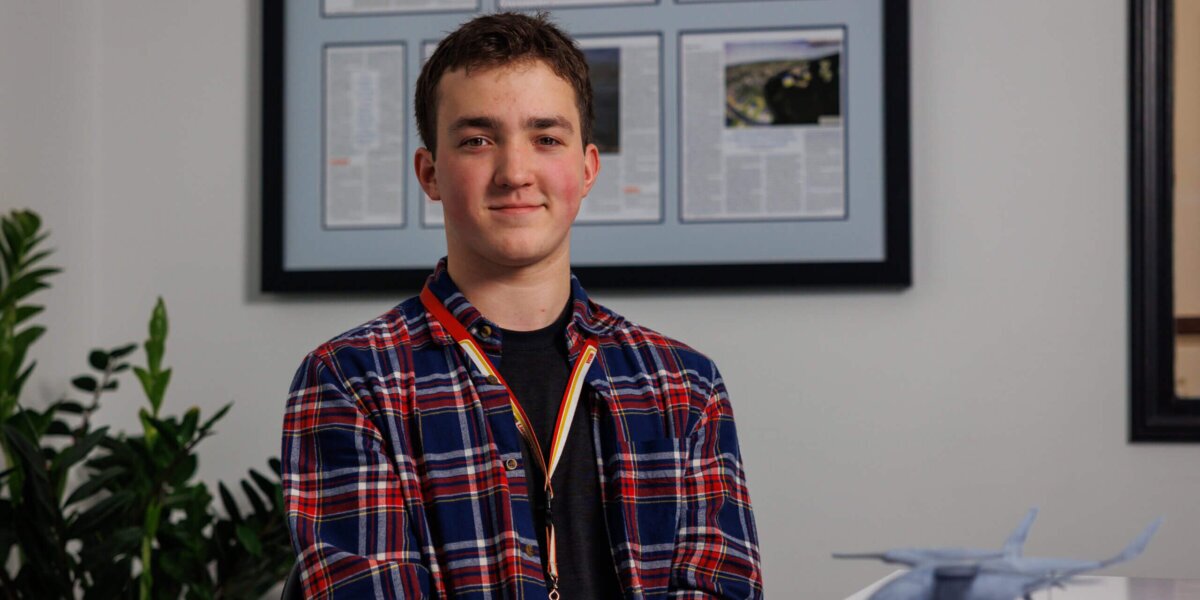 Keating Carpenter sitting at a desk at BETA Technologies.