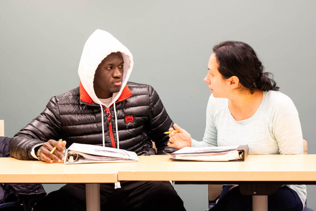 Lizette Davis, right, works with classmate Ismail Liban.