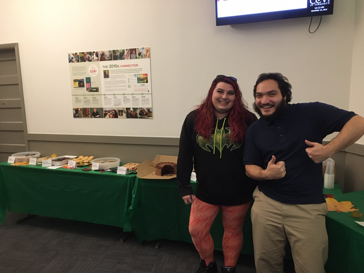 Student Leadership Advisory Council members Josie Winters and Elias Maldonado showcase Middlebury's inaugural Bake-Off on November 19.