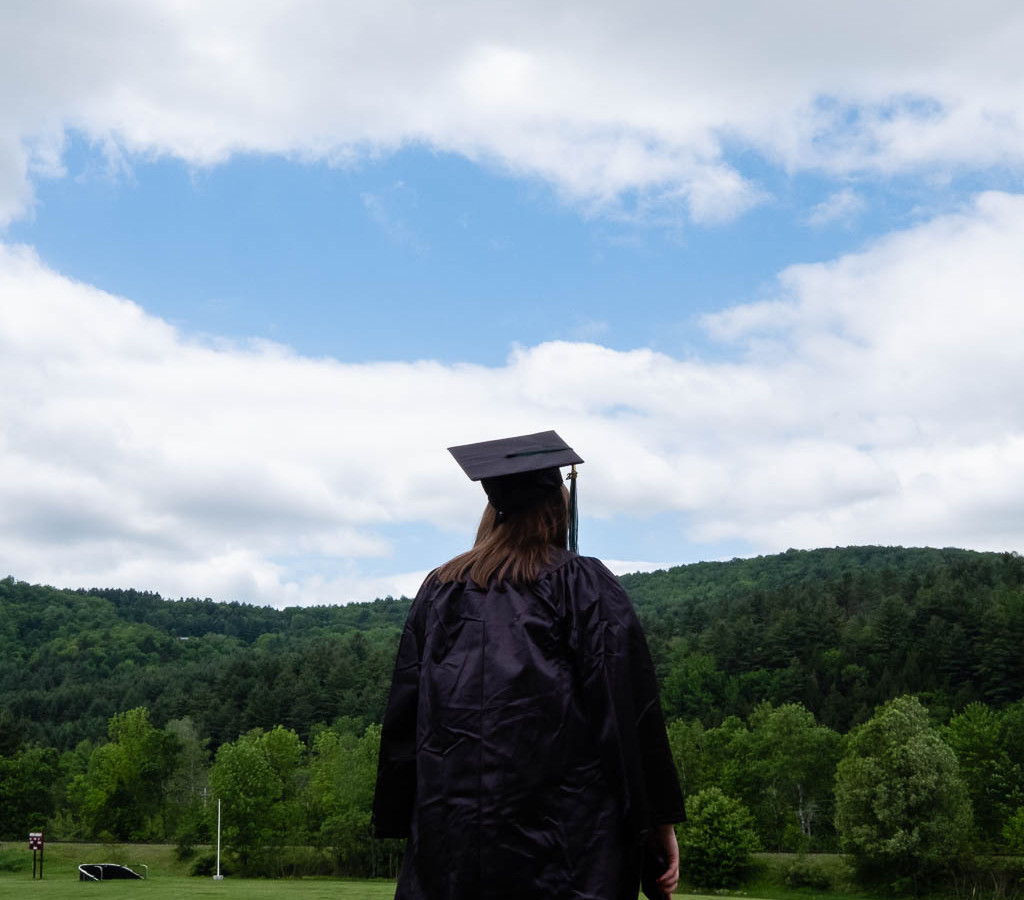 Girl in cap and gown facing away
