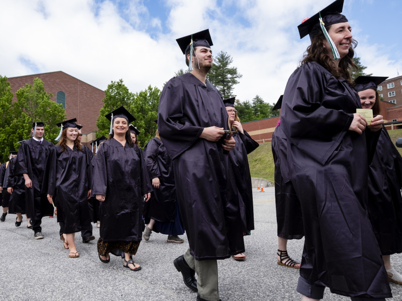 Graduates walking to commencement