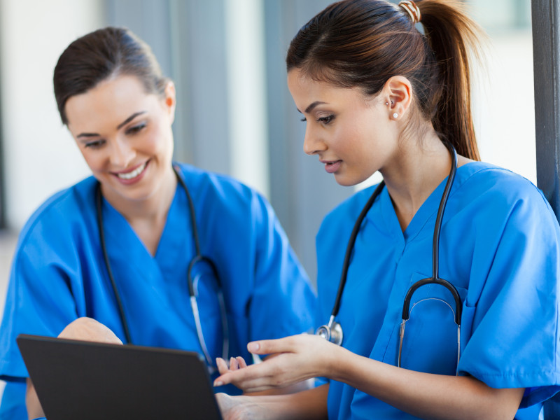 healthcare workers using laptop