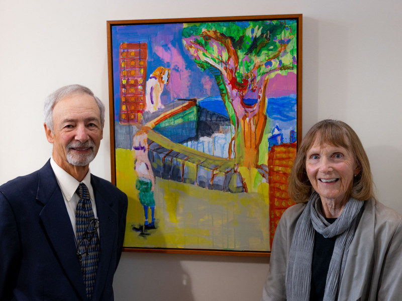 Bill Geiger and Joyce Judy in front of painting