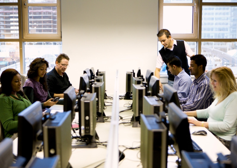 Students in a computer lab classroom.