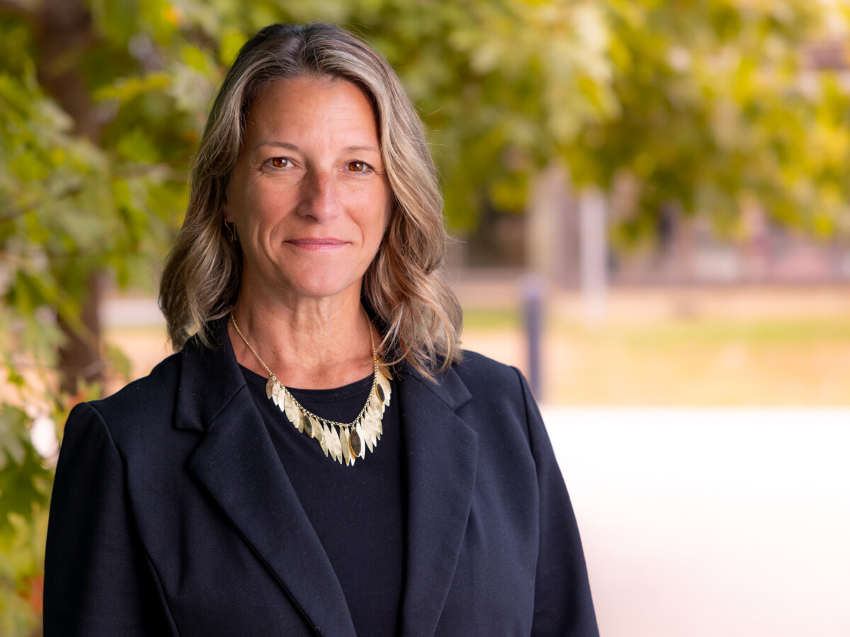 Faculty member Virginia Merriam wearing a black jacket outside the CCV-Montpelier center.