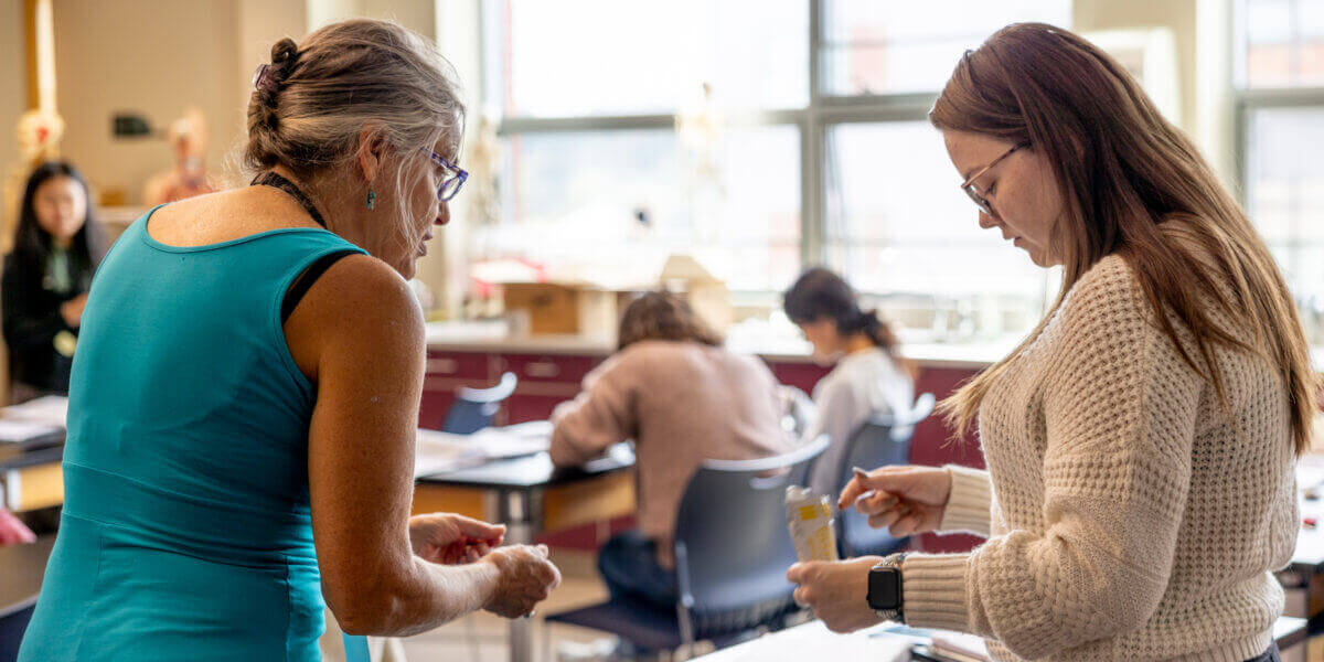 instructor talking with student