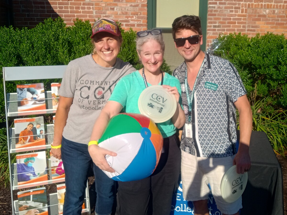 Three CCV staff members tabling at a local gallery walk.