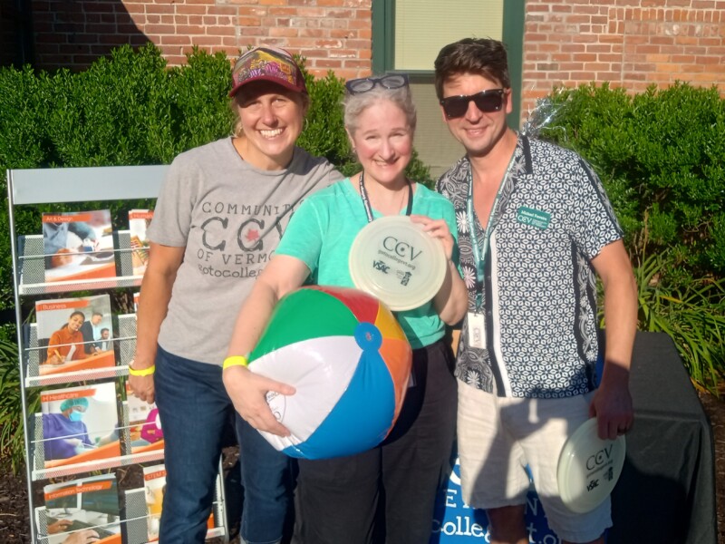 Three CCV staff members tabling at a local gallery walk.
