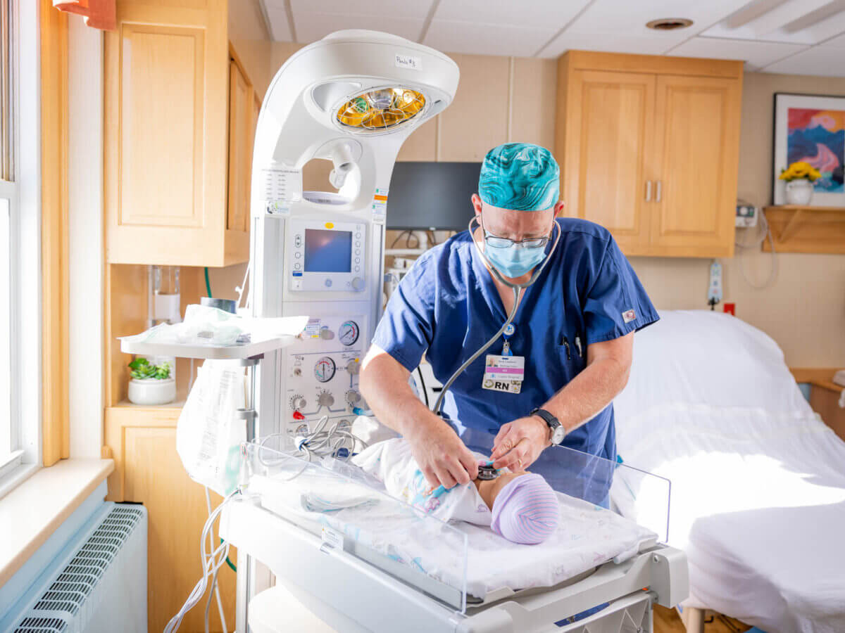 Scott Lamberti in hospital room monitoring baby