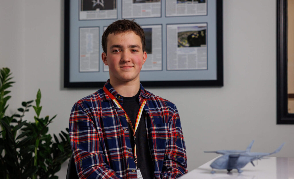 Keating Carpenter sitting at a desk at BETA Technologies.