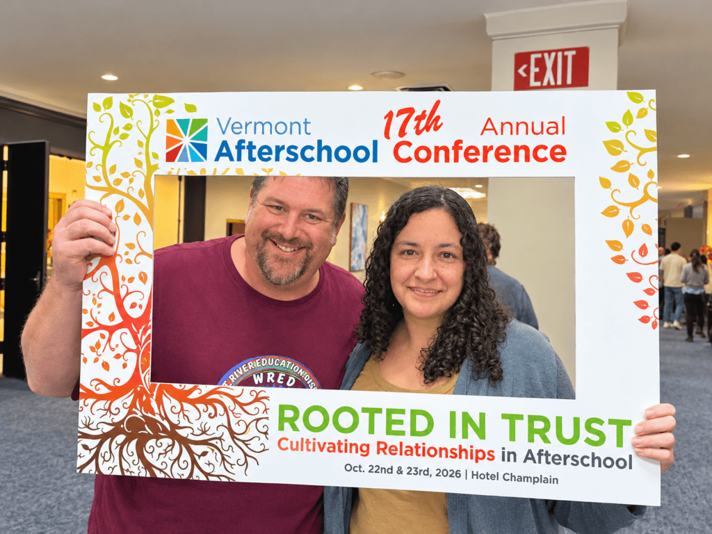 Two people inside a frame that says "Vermont Afterschool 17th Annual Conference"
