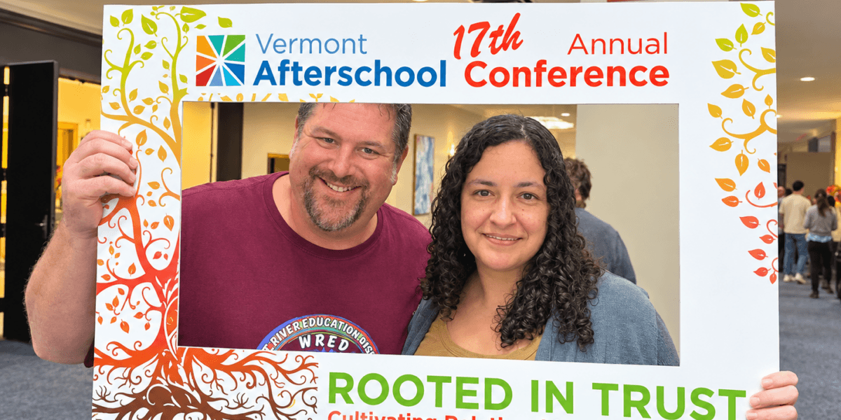 Two people inside a frame that says "Vermont Afterschool 17th Annual Conference"
